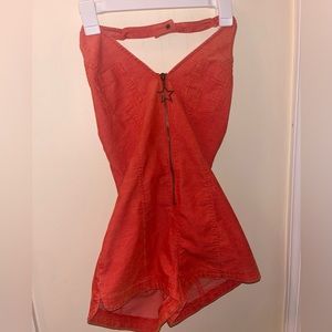 Orange romper. Never worn.